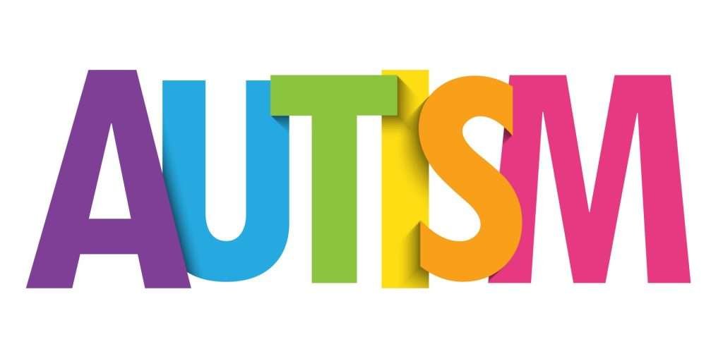 The word Autism in block letters and rainbow colours